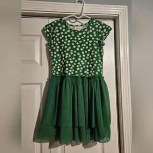 Hanna Andersson green dress with a white daisy pattern bodice and a tulle skirt